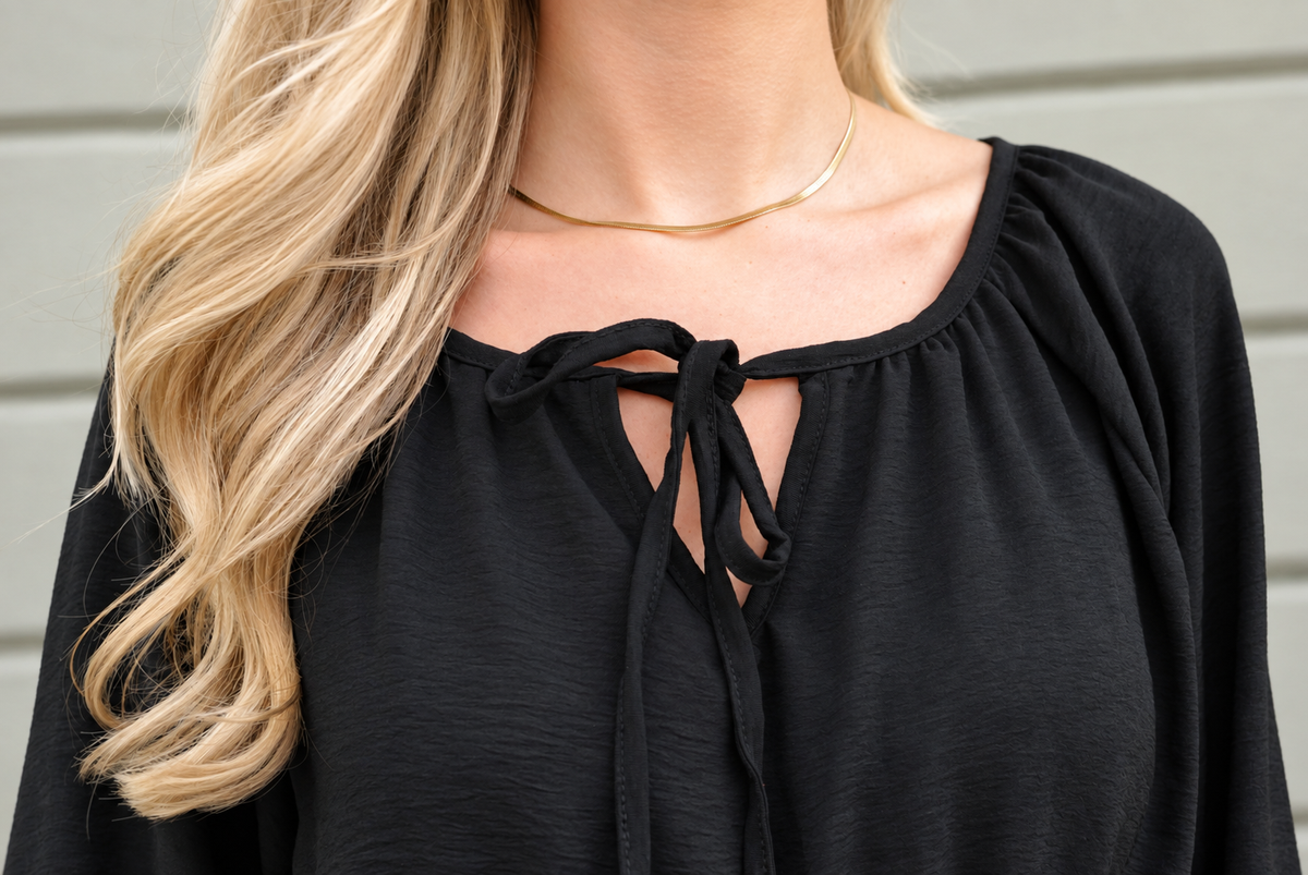 Svart playsuit med markerad midja